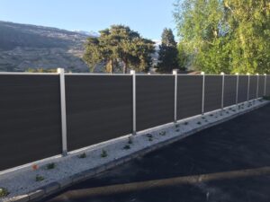 Wood plastic composite fence with natural wood grain texture