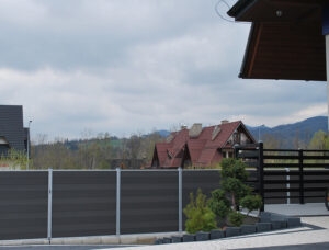 Dark grey Mecofence WPC composite fence, delivering durable and low-maintenance boundary solutions for global residential constructors.