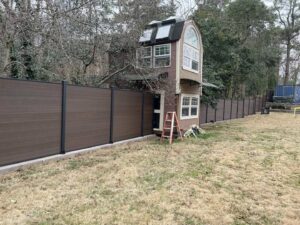 Solid brown Mecofence WPC privacy fence for suburban backyards, offering quick-install, durable boundary solutions for residential constructors.