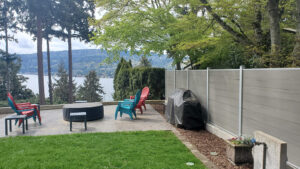 Light grey Mecofence WPC composite privacy fence for waterfront patios, offering high moisture resistance for coastal constructors.