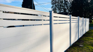 Pure white composite fence with white post offering modern privacy and weather-resistant outdoor protection.