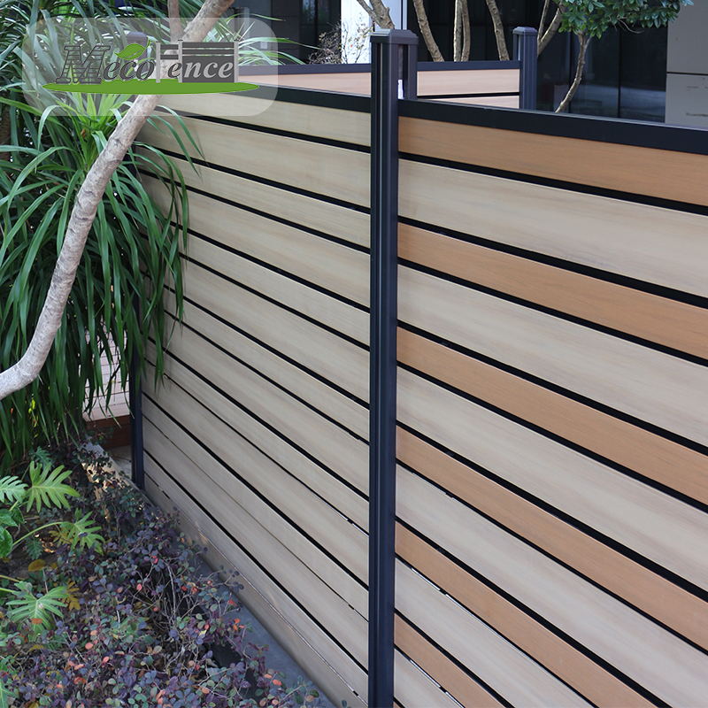 Installed ASA co-extrusion PVC fence with mixed light and wood-look horizontal boards, dark aluminium posts and concealed gaps in a landscaped garden
