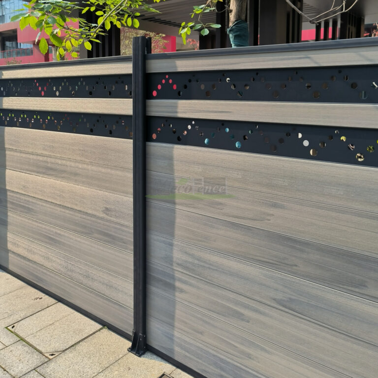 MecoFence carving decorative composite fence panel with laser-cut leaf vein pattern on upper section, casting ornamental shadows on the ground