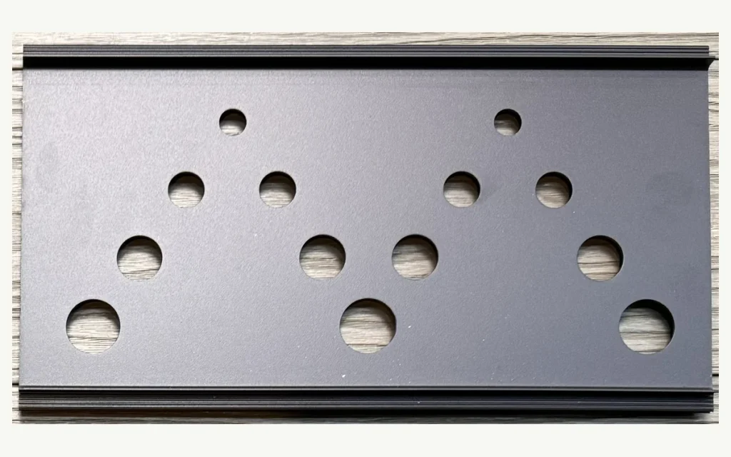 Decorative aluminum fence screen with graduated circular cutouts