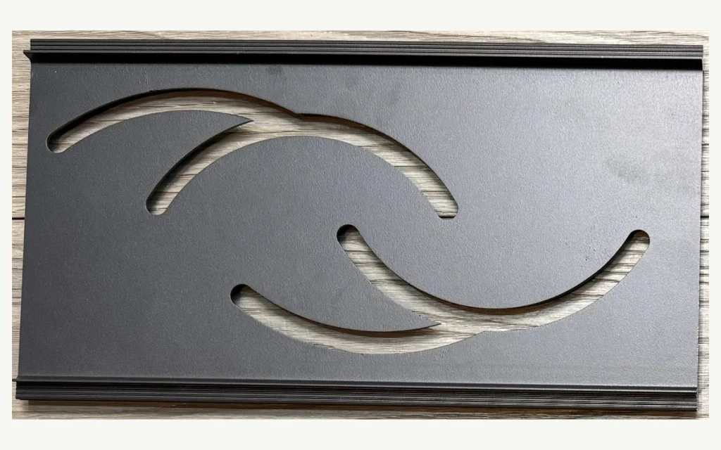 Decorative aluminum fence screen with curved sea wave cutouts