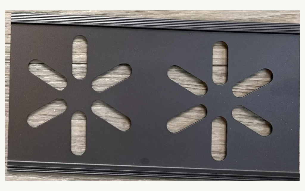 Decorative aluminum fence screen with repeating snowflake cutouts