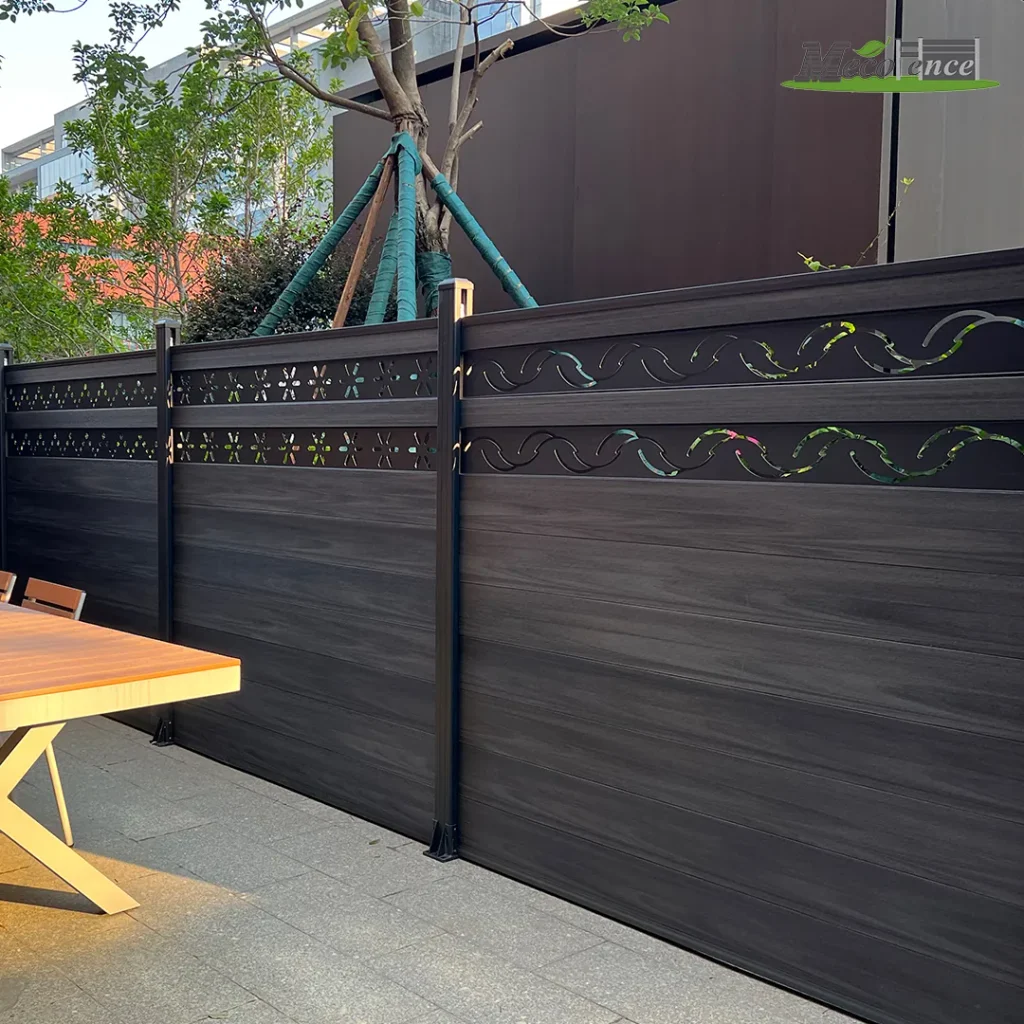 Dark grey decorative-top composite kit fence with carved wave-pattern accent boards