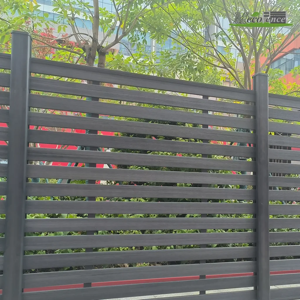 Dark grey full-trellis composite kit fence with evenly spaced horizontal boards