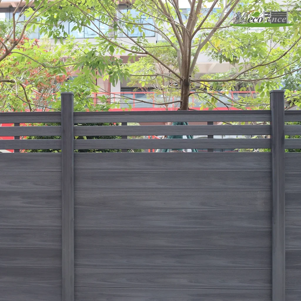 Dark grey trellis-top composite kit fence with solid boards below an open slatted top