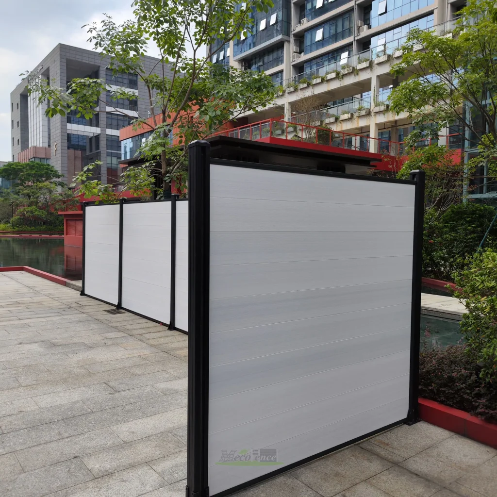 White composite fence corner installation with black aluminium posts