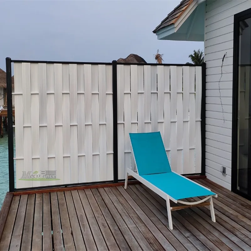 White woven composite privacy fence installed on an overwater villa deck with a sun lounger