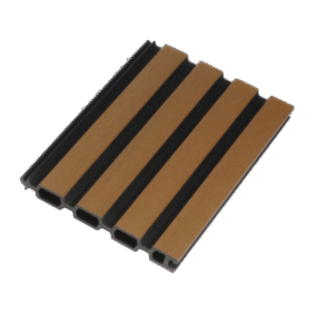 A cross-section cut of a Mecofence composite board, revealing the co-extruded dual-tone structure with a deep black core forming the recessed grooves and a wood-toned layer forming the raised slats.
