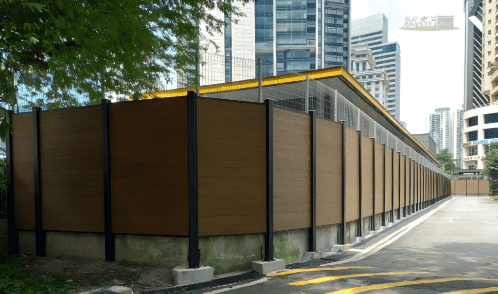 Close-up of the MecoFence Concrete Surface Anchoring system, showing a heavy-duty aluminum post base plate secured to an existing concrete patio or driveway using expansion bolts, facilitating