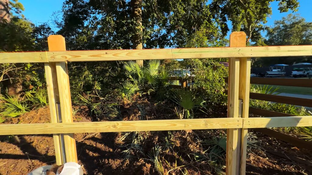 Staggered fence rail joints illustration for increased wind resistance.