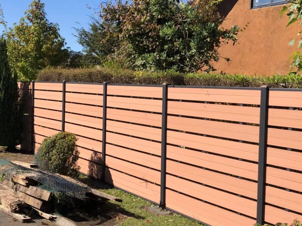 MecoFence Sanded finish on 1st generation teak composite fencing showing natural matte texture