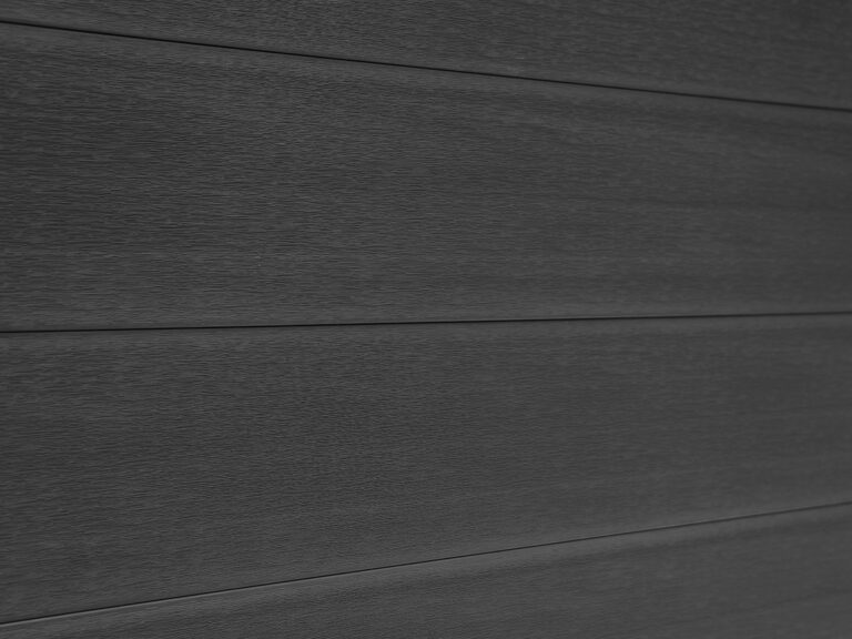 Mecofence dark grey wood plastic composite fence for outdoor garden enclosures.