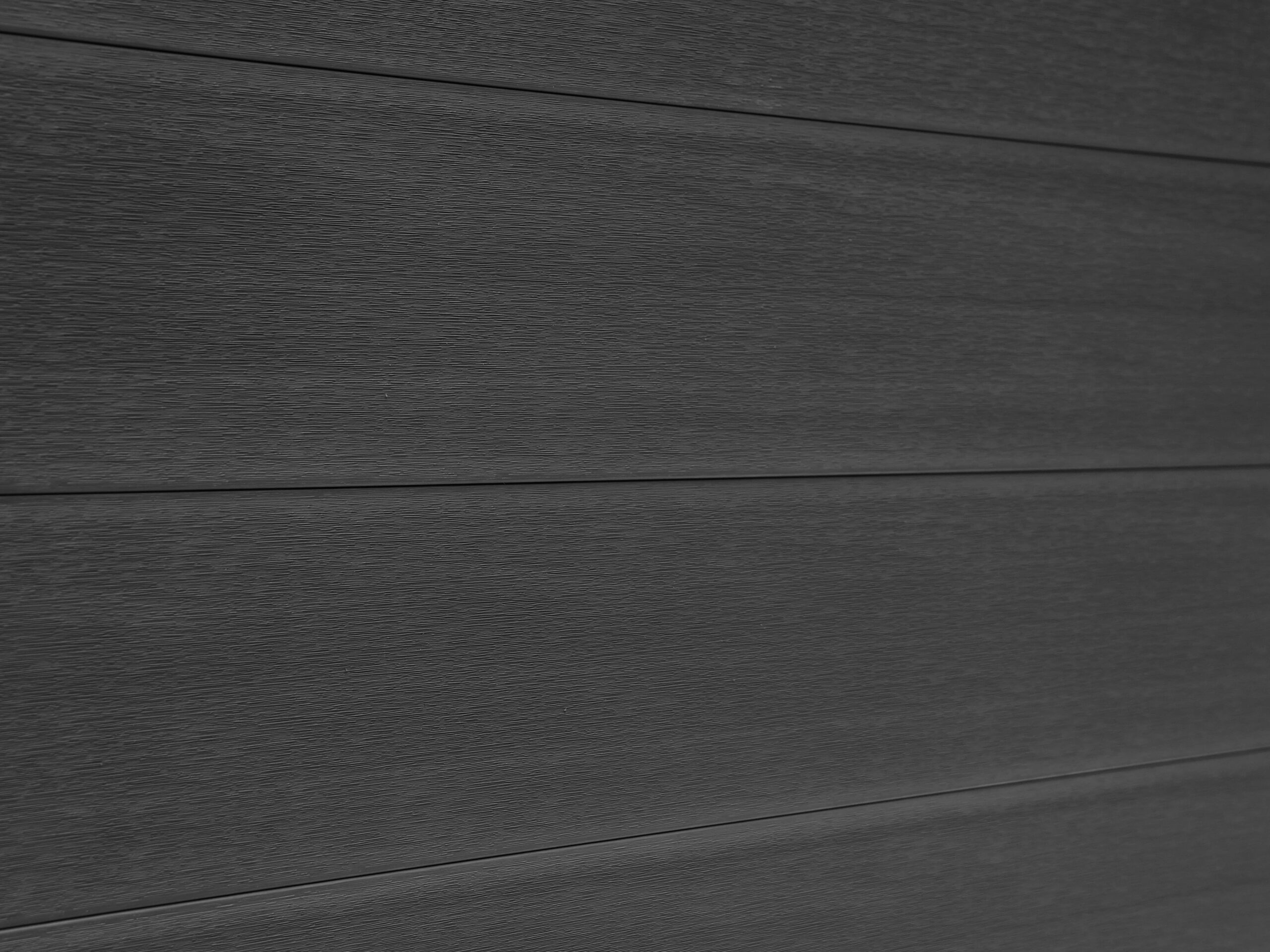 Mecofence dark grey wood plastic composite fence for outdoor garden enclosures.