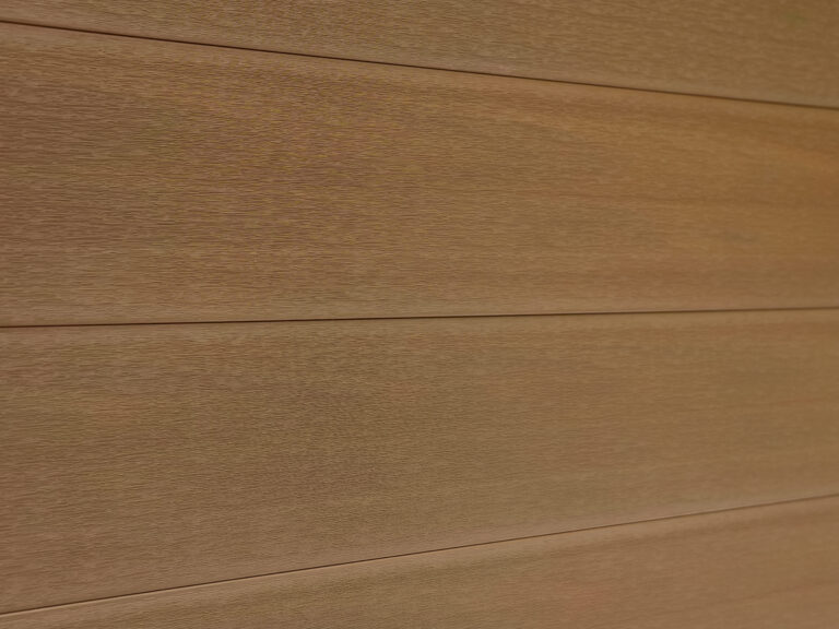 Mecofence natural teak composite fencing color option with wood grain texture.