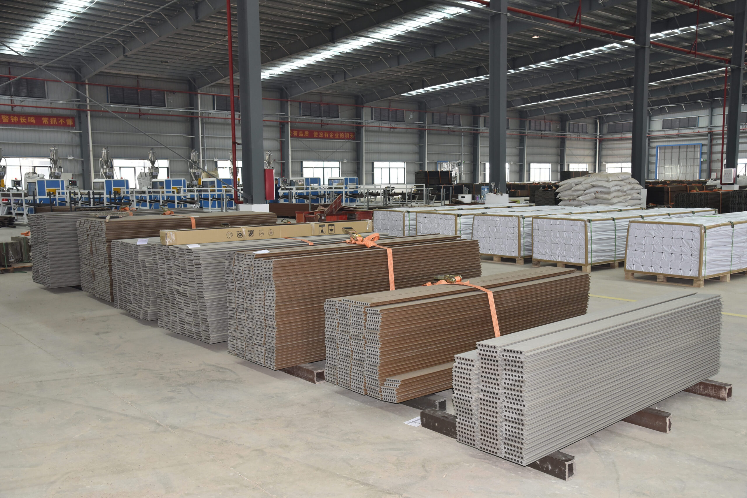 WPC fence boards standing and stacking during quality control cooling process