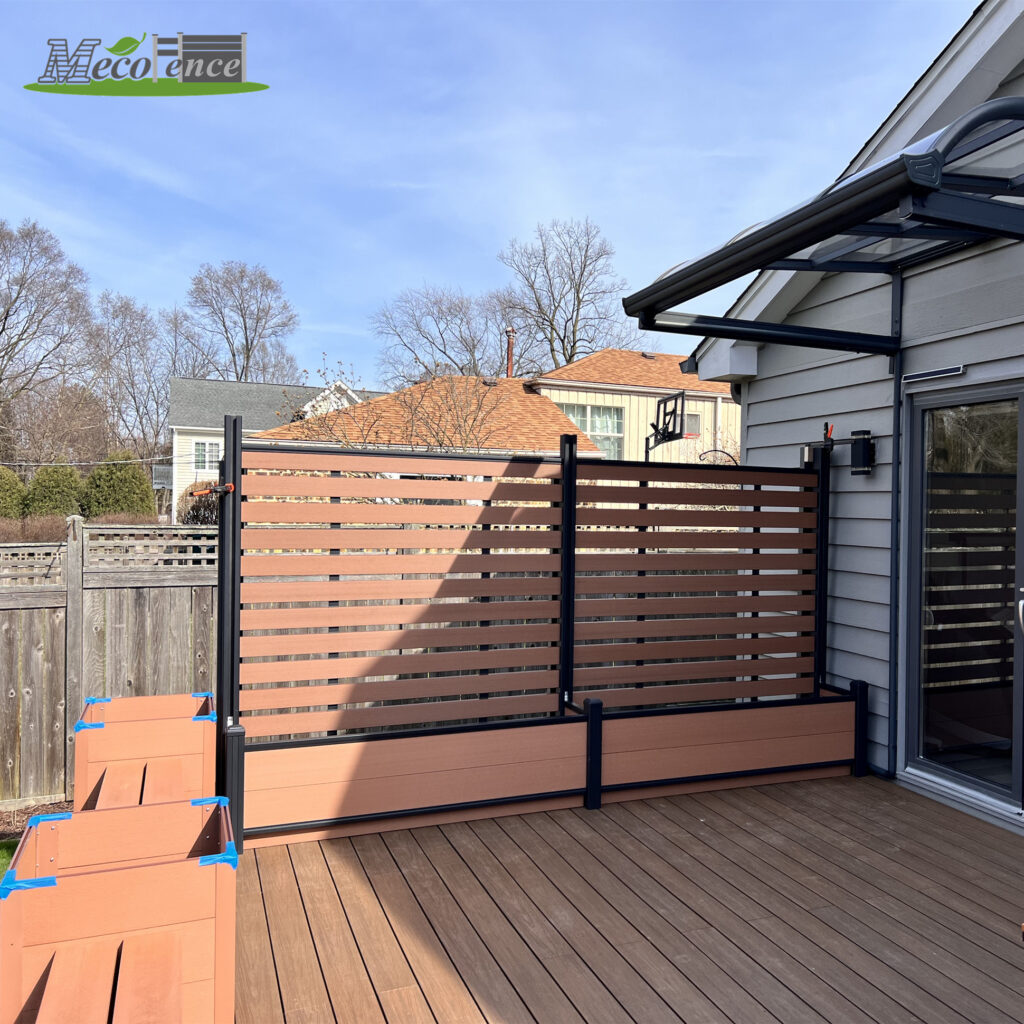 MecoFence WPC composite planter box with horizontal trellis panel installed on residential backyard deck in terracotta brown and black aluminum frame