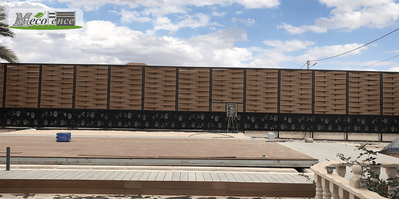 Completed MecoFence composite slat fence on a hot-climate project in Israel under strong desert sun