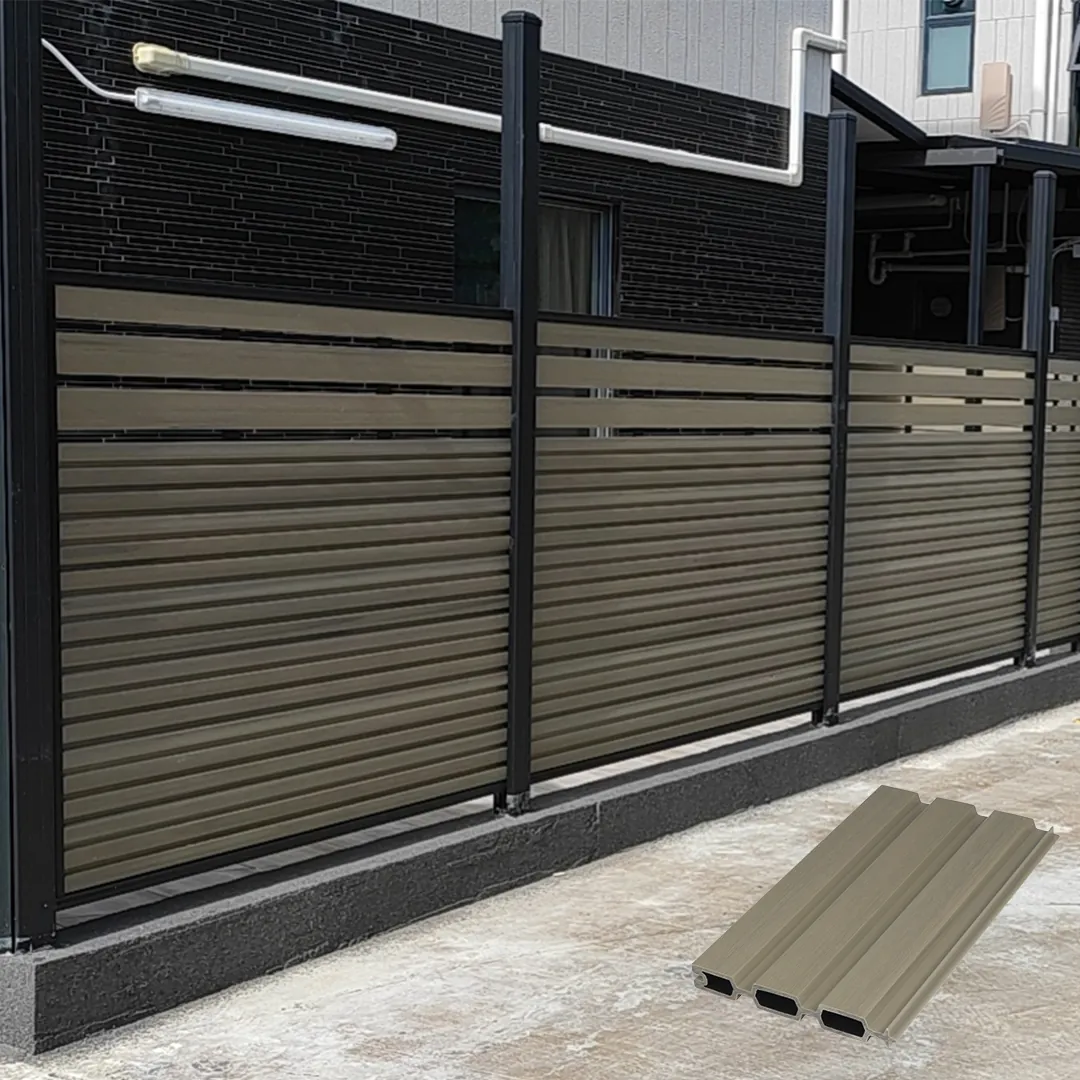 Ashwood fluted composite fence with black aluminum posts mounted on a concrete curb