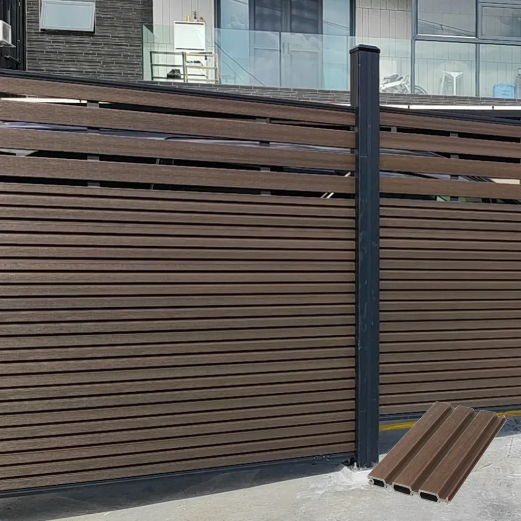 Walnut fluted composite fence with semi-privacy open slat design in front of a building