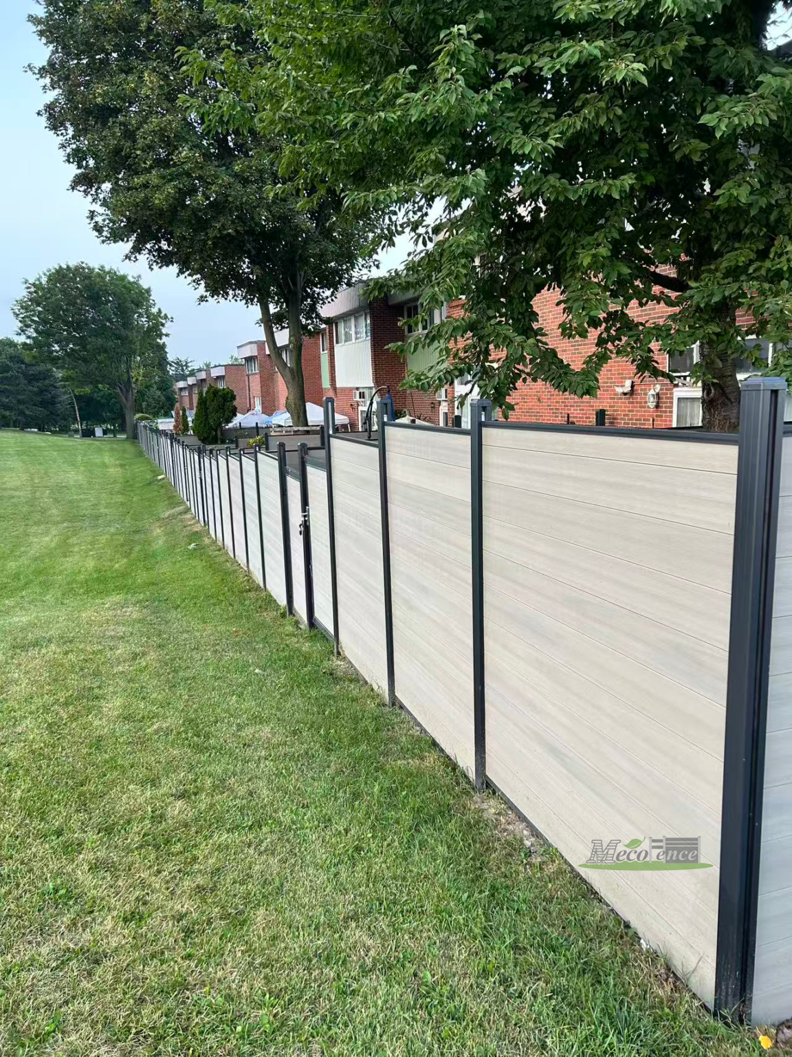 Ashwood composite fence-and-gate system at the Toronto project revisited by MecoFence in August 2026.