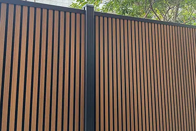 MecoFence vertical slat Teak and black dual tone composite fence with black aluminum frame